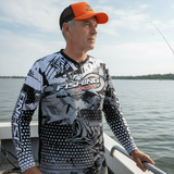 Angler in black and white jersey with orange Spinallis hat
